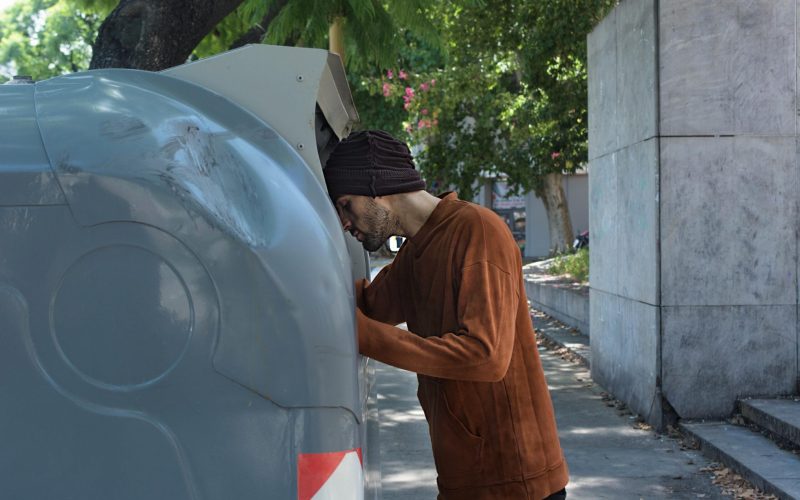 homeless-looking-through-trash-bins-streets
